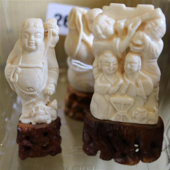 Three small Chinese carved ivory figures, on integral pierced wood bases